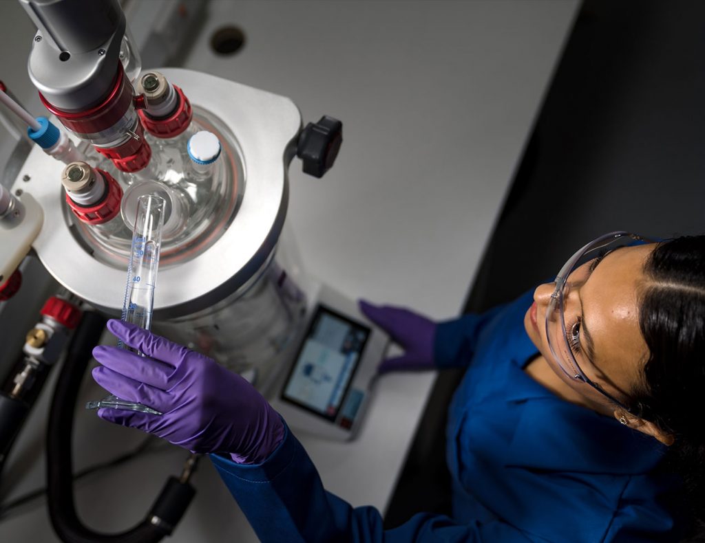 Atlas-HD-chemist-in-lab-pouring-Image-Gallery-Large-1024x0-c-default